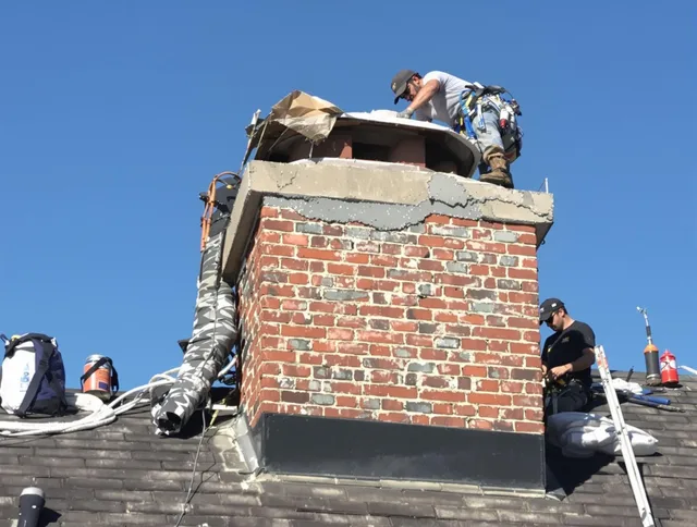 Wilton Chimney Sweep installing a custom chimney crown in Wilton, CT