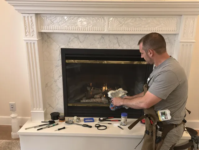 Wilton Chimney Sweep performing fireplace maintenance in Wilton, CT