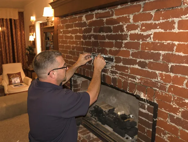 Wilton Chimney Sweep expert fixing a fireplace in Wilton, CT